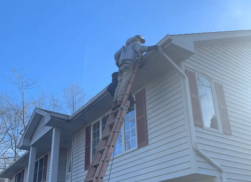 Gutter cleaning and maintenance being performed by Lorain Power Washing in Lorain